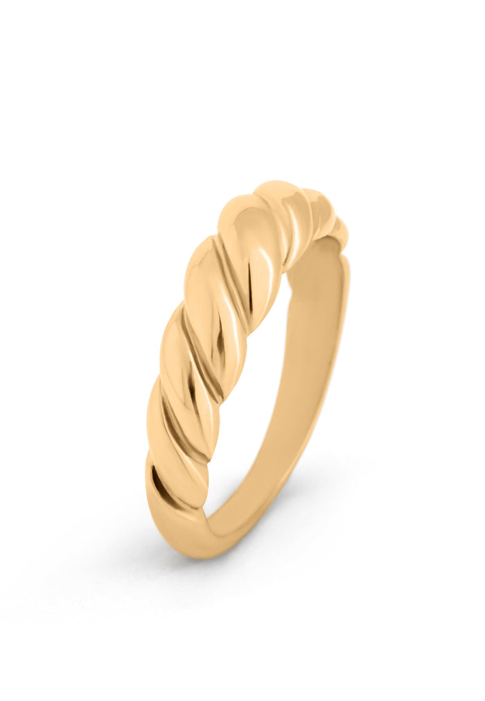 Gold ring with a twisted design on a white background