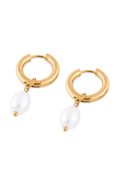 Gold hoop earrings with pearl drops on a white background