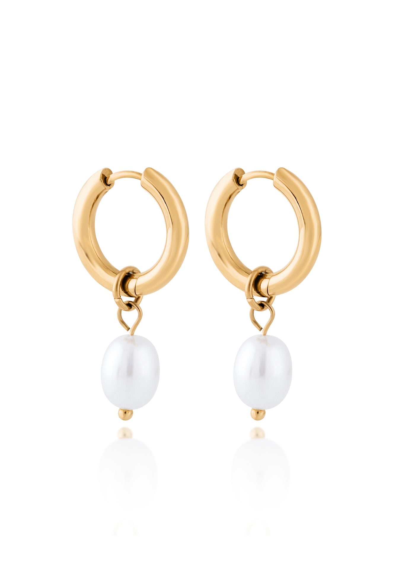 Gold hoop earrings with white pearls on a white background