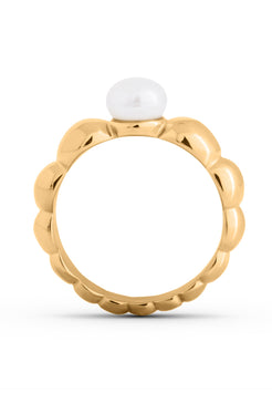 Gold ring with a white gemstone on a white background