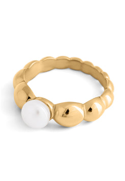 Gold ring with a central pearl on a white background