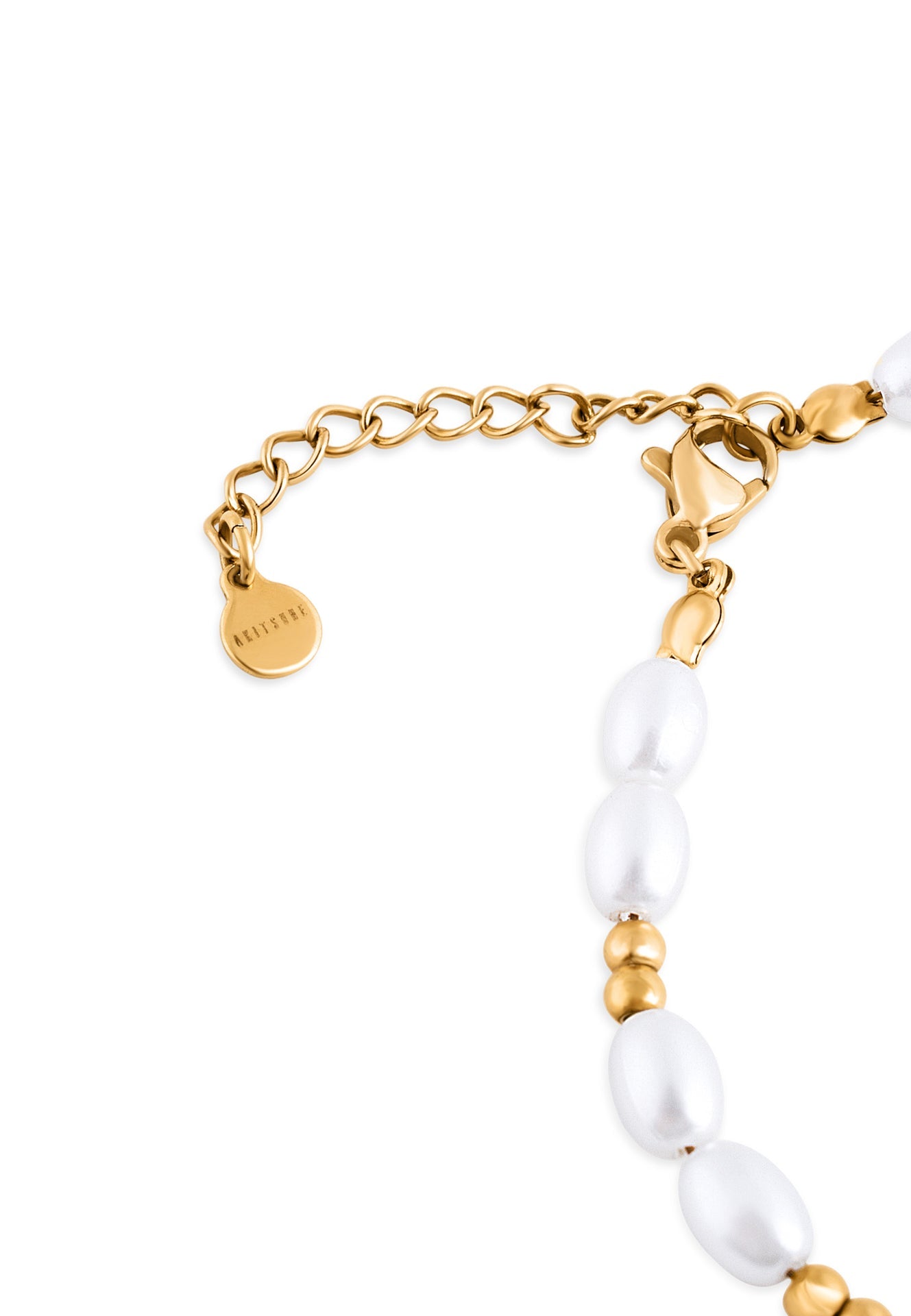 Gold bracelet with white pearls on a white background