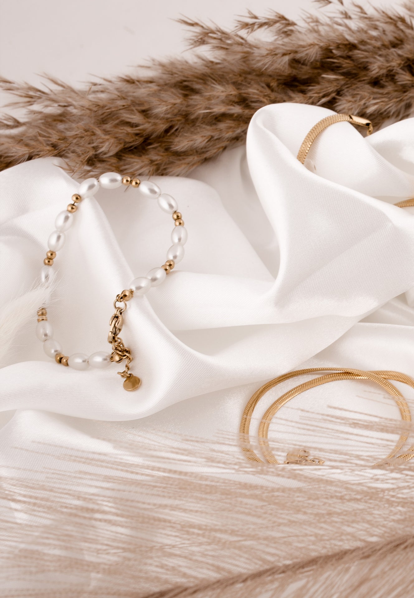 Bracelet on a white fabric with a fur background