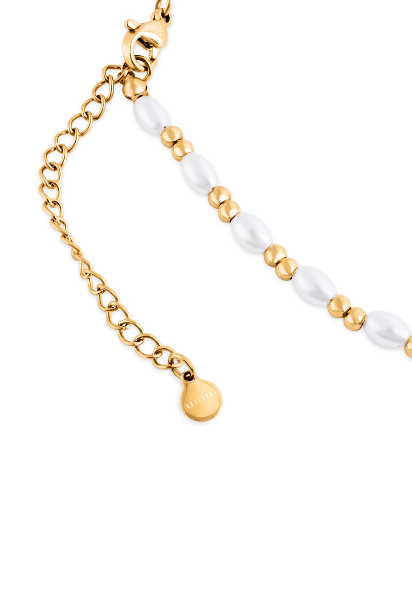 Bracelet with gold chain and white beads on a white background