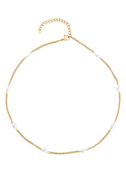 Gold necklace with white beads on a white background
