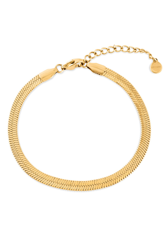 Gold bracelet on a white background