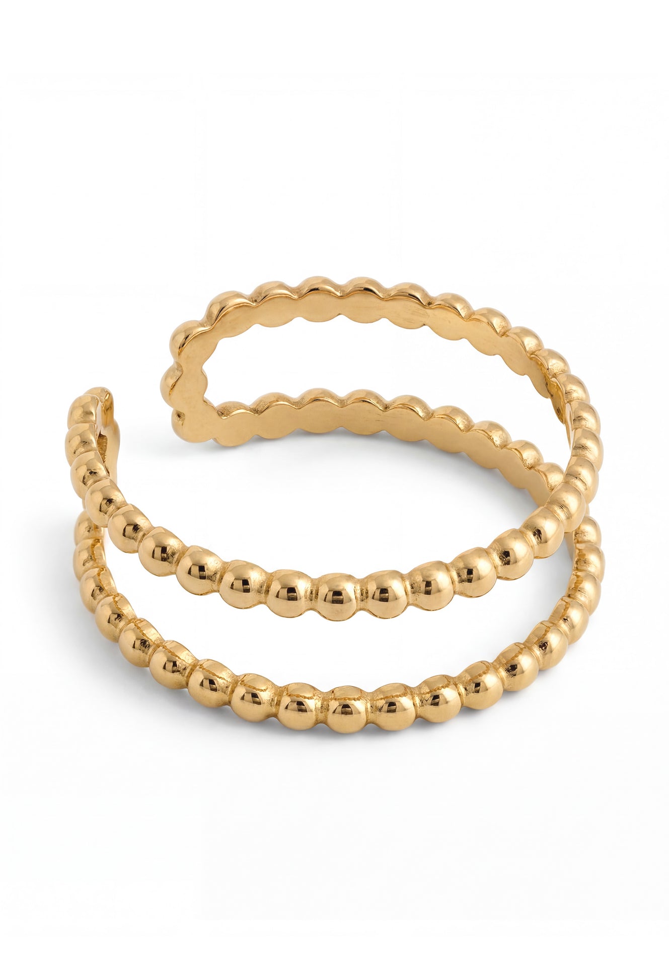 Two gold beaded rings stacked on a white background