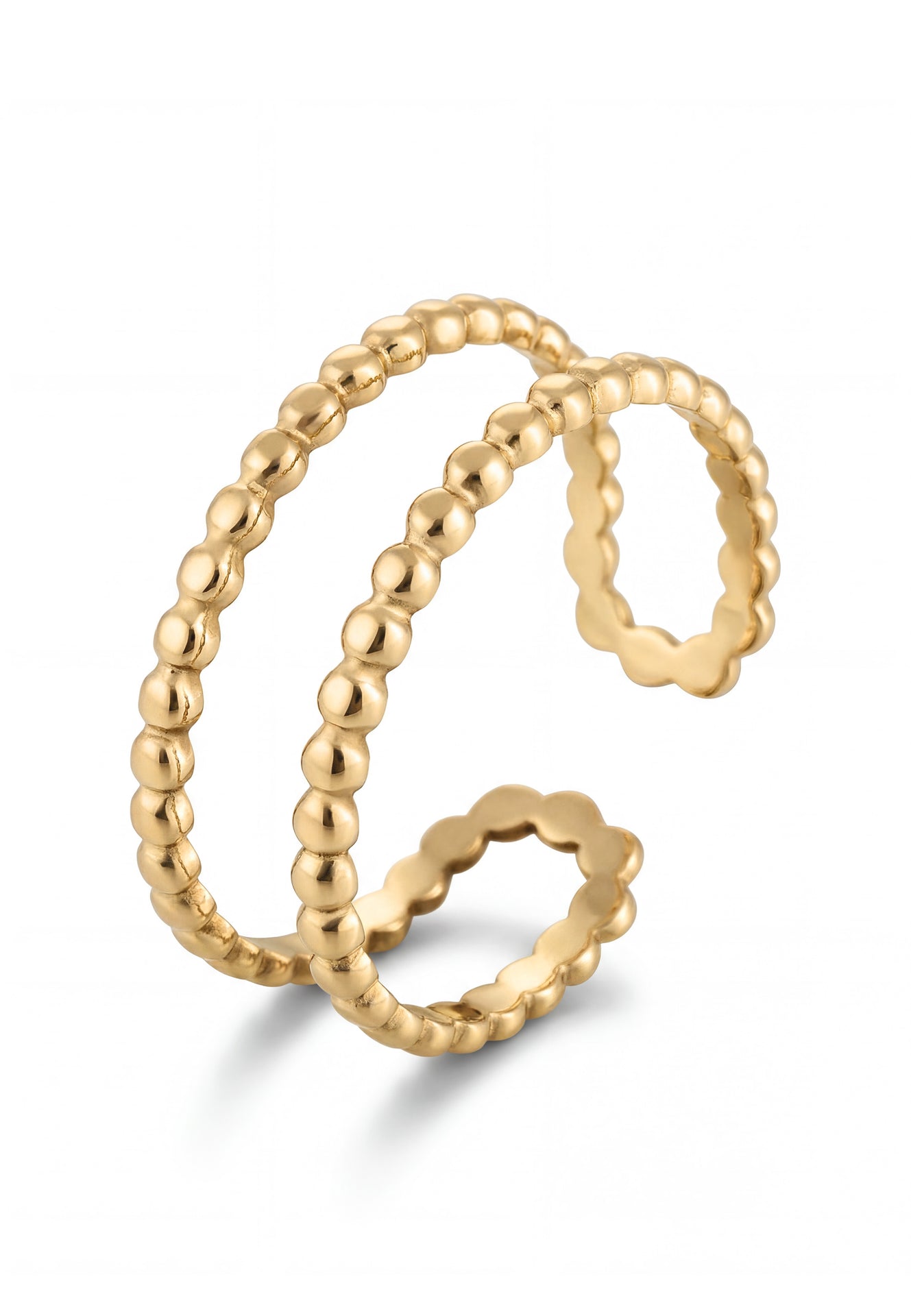 Two gold rings with beaded design on a white background