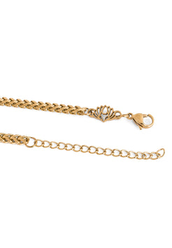Gold chain bracelet on a white background