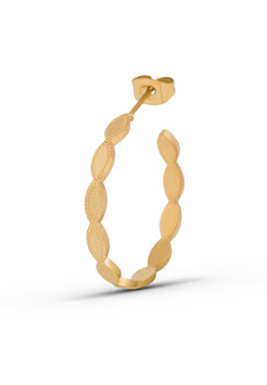 Gold hoop earring on a white background