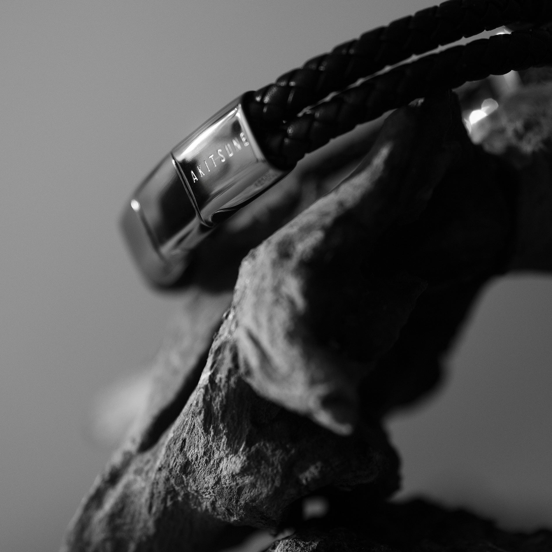 Close-up of a bracelet with a textured surface and blurred background
