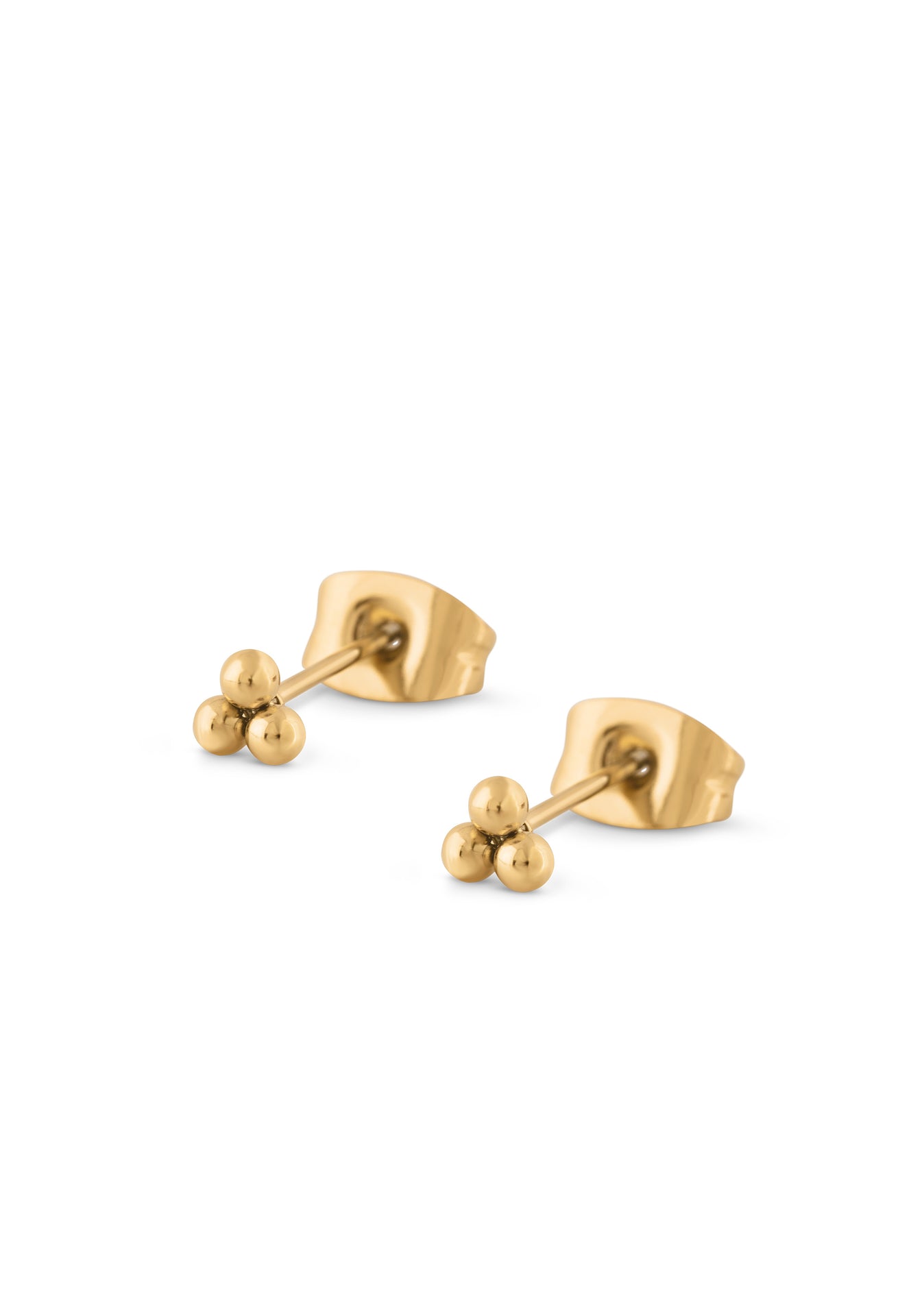 Gold stud earrings on a white background
