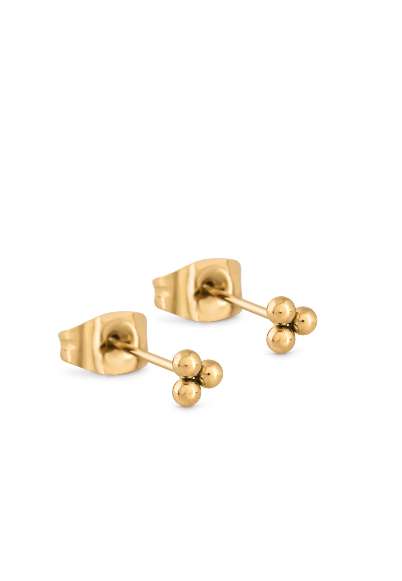 Gold stud earrings on a white background