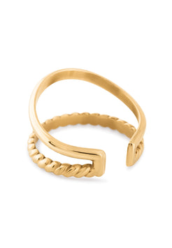 Gold ring with twisted design on a white background