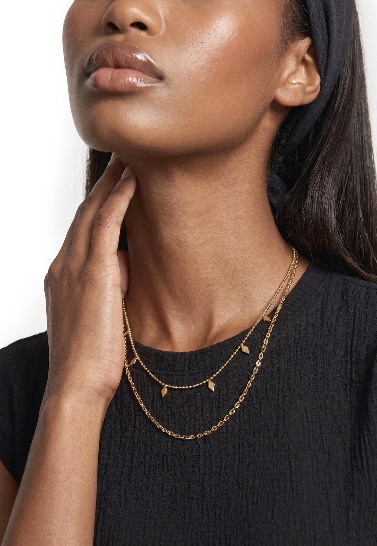 Akitsune Reverie Necklace Set gold tone, close-up on a model