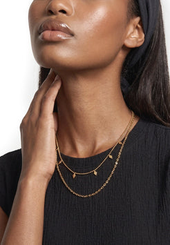Akitsune Reverie Necklace Set gold tone, close-up on a model