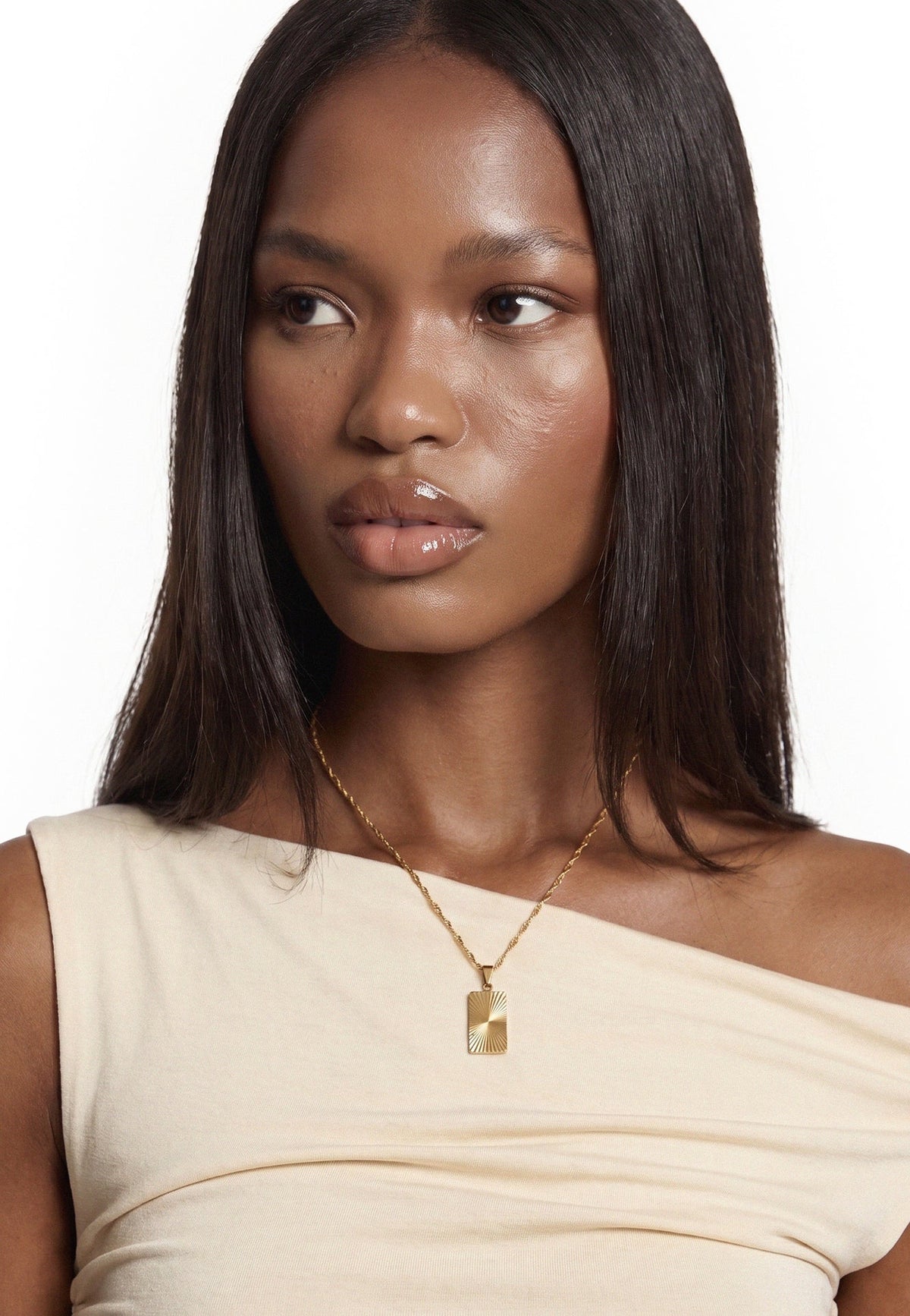 Akitsune Solenne Sun Tag Necklace gold tone, worn by a model