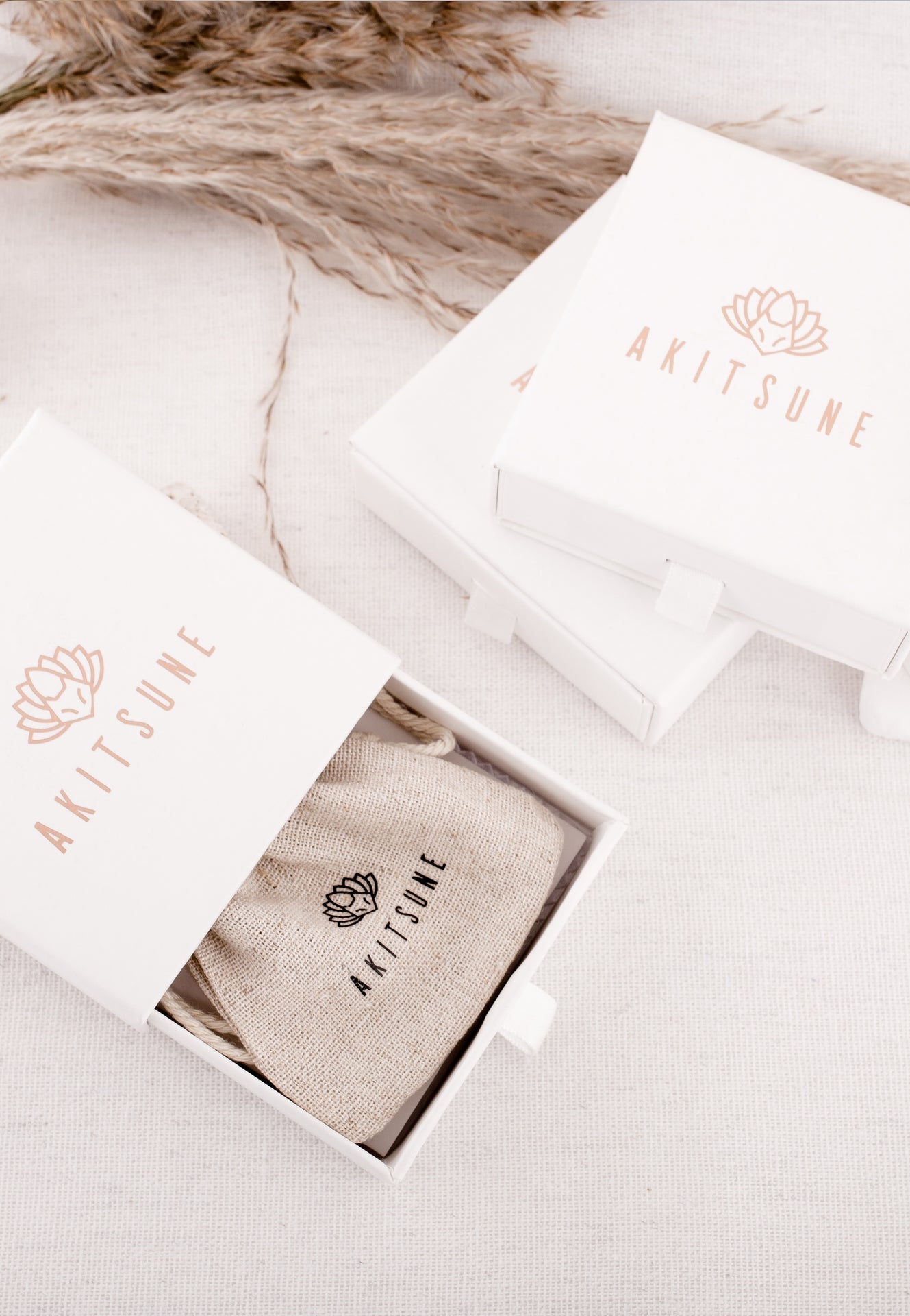 Akitsume product packaging on a marble surface