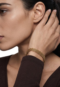 Akitsune Caelus women's bracelet in gold tone, worn by a model