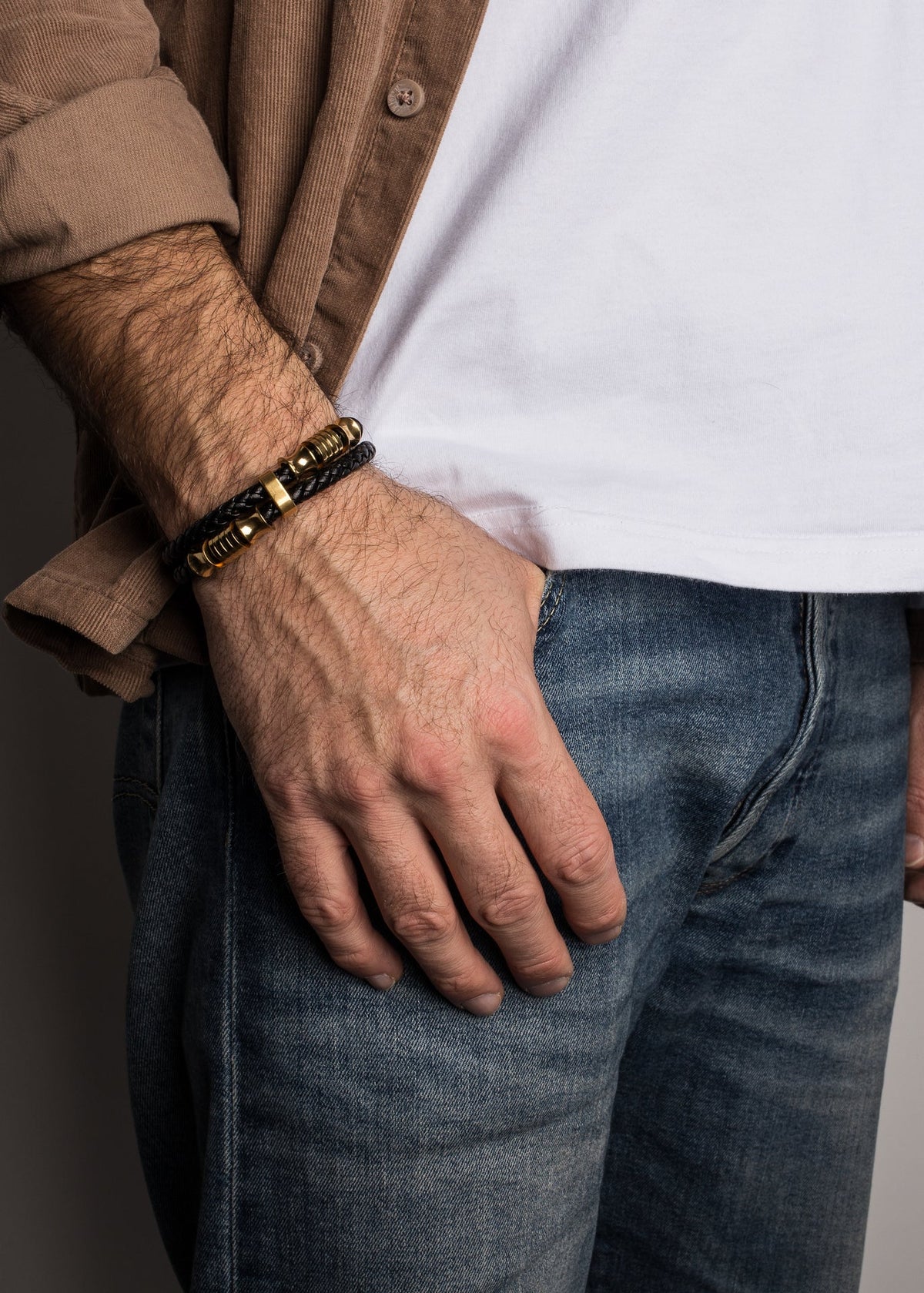 Close-up of a person wearing a bracelet, with a focus on the wrist and hand.