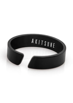 Black bracelet with 'AKITSUNE' branding on a white background