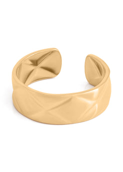 Beige cuff bracelet on a white background