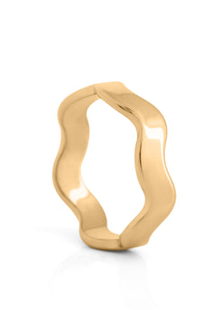 Gold ring with a wavy design on a white background