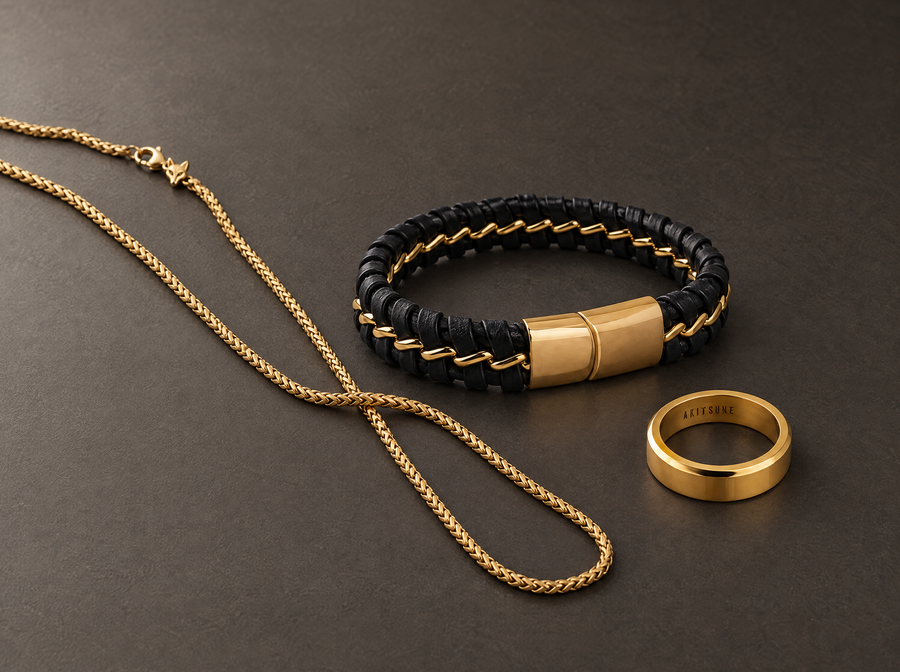 Akitsune men’s jewelry collection on a charcoal background